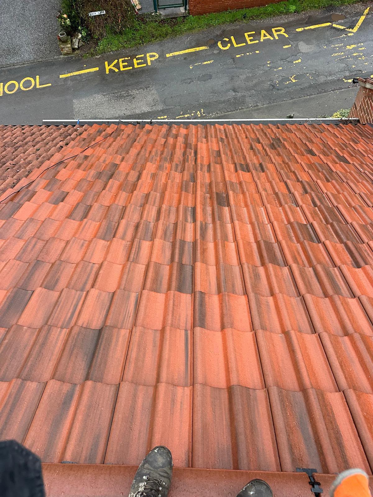 Completed bright red interlocking tiled roof finished by One Stop Roofing