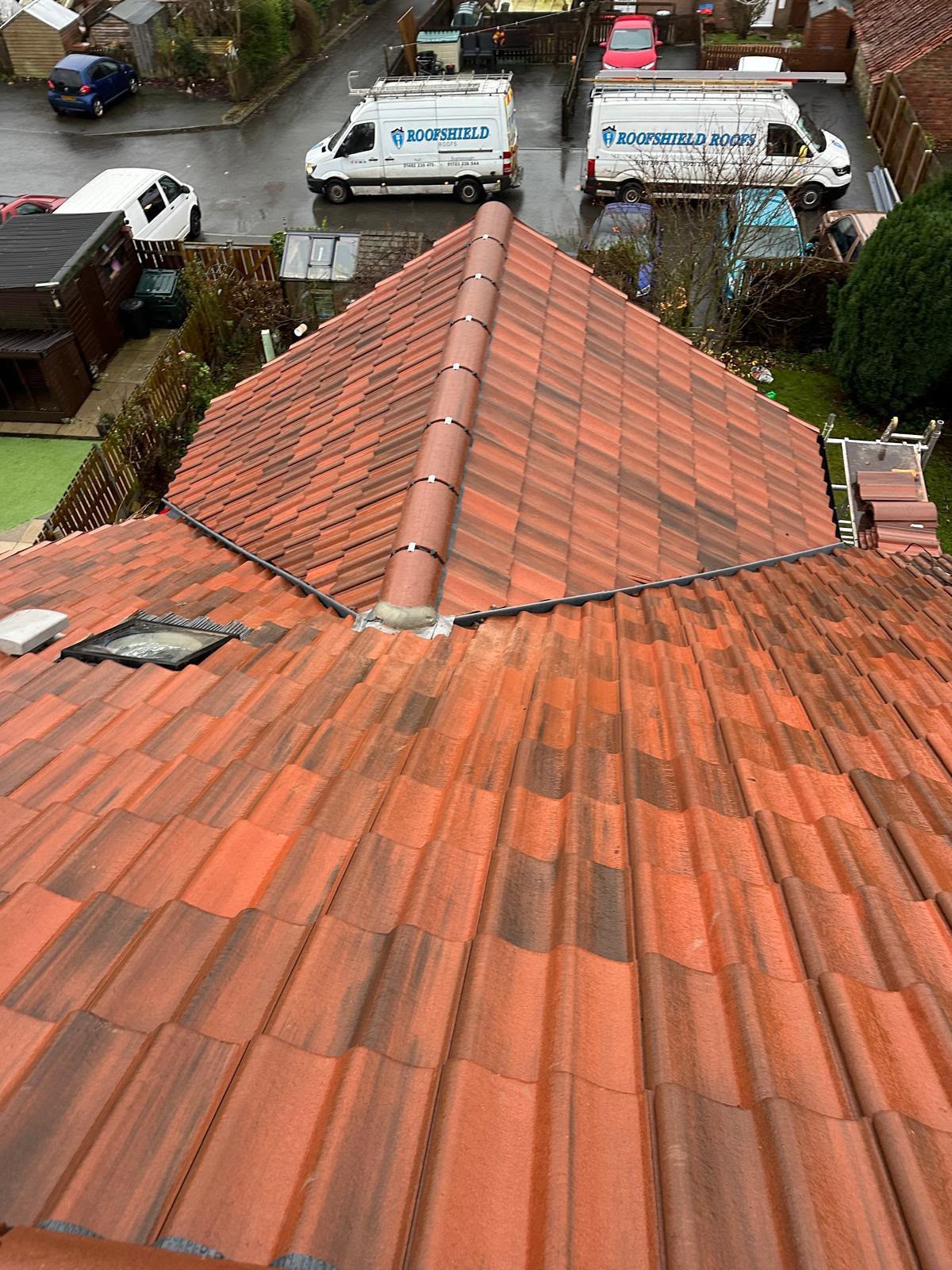 Finished red tiled hipped roof with dry ridge and dry hip system installed in Yorkshire