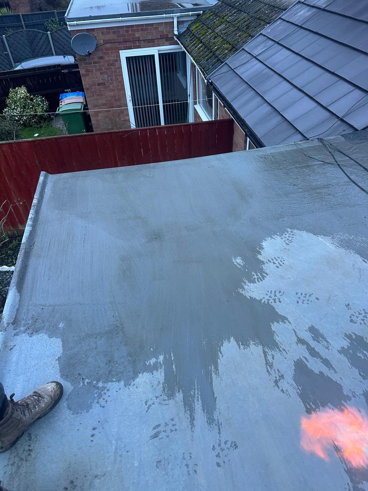 GRP fibreglass flat roof coating applied to a residential extension by One Stop Roofing