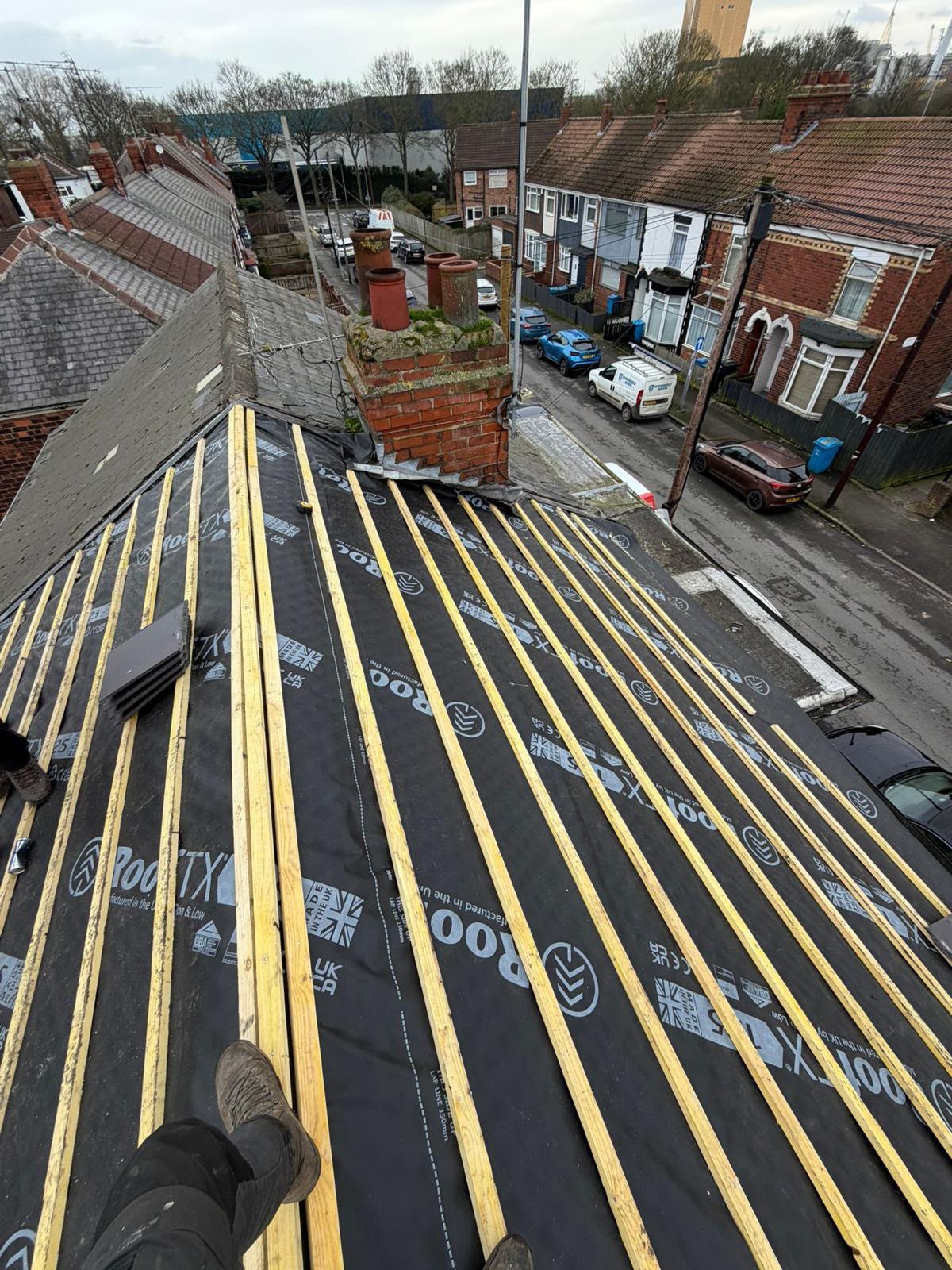 Roof stripped to the rafters with new black breathable membrane and timber battens fitted