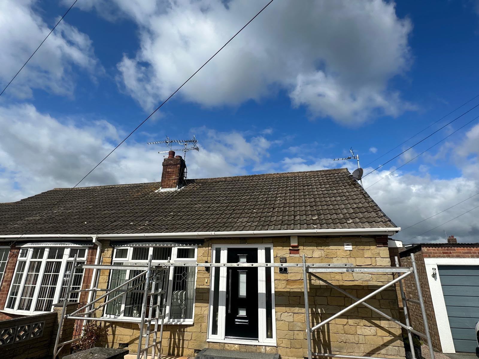 Old brown tiled bungalow roof with scaffolding erected, ready for a full re-roof by One Stop Roofing