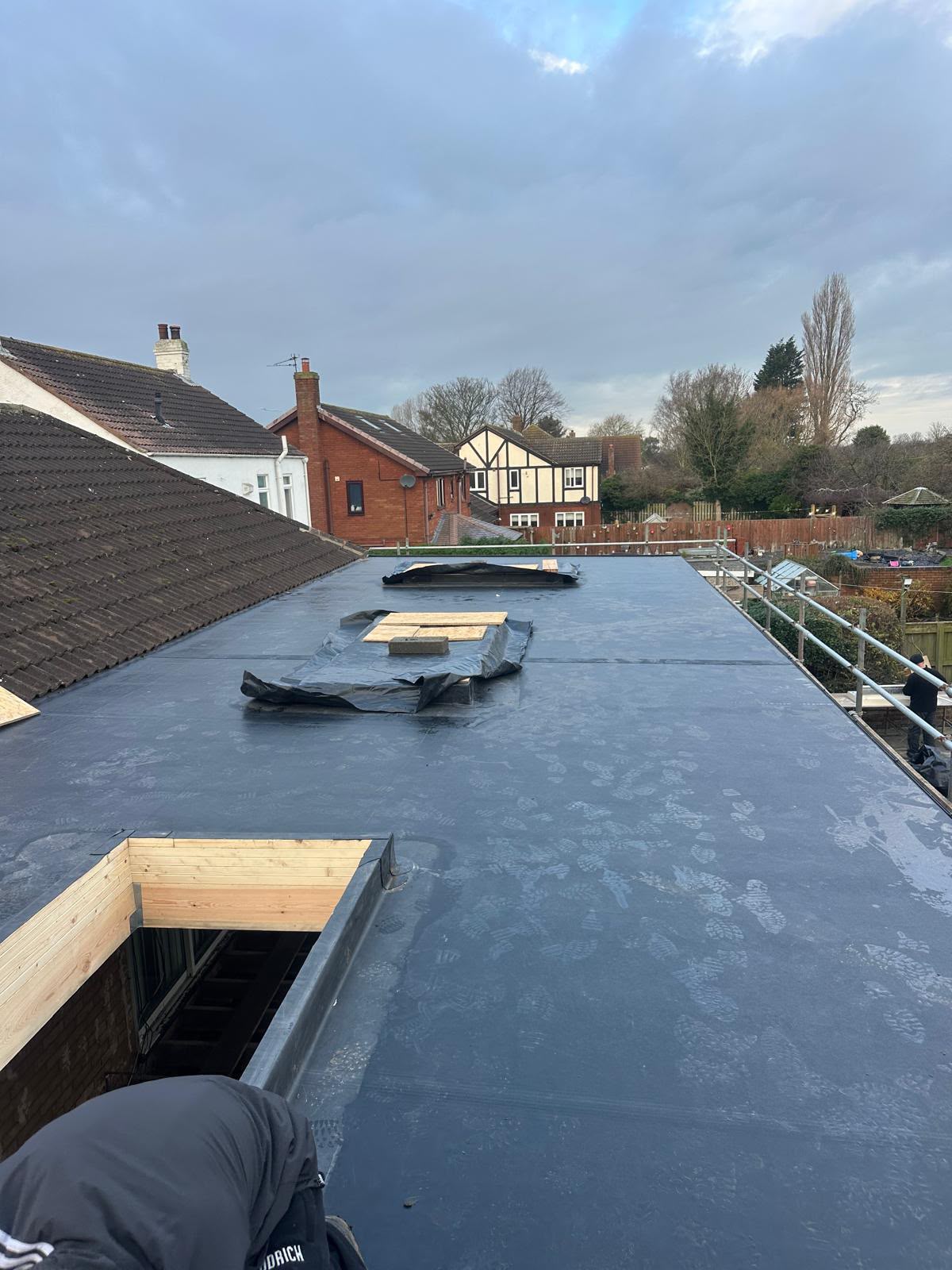 Completed EPDM rubber flat roof with framed rooflight upstands installed in Yorkshire